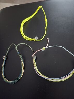 Set of Three Colorful Woven String Bracelets